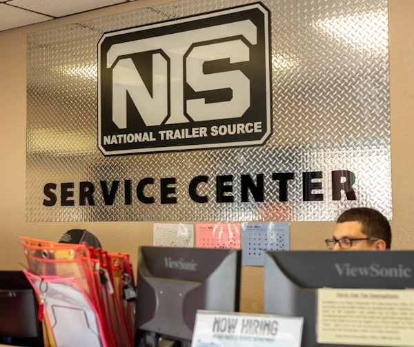 Trailer service bay with technicians working